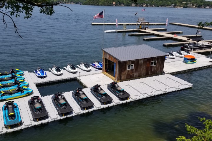a boat is docked next to a body of water