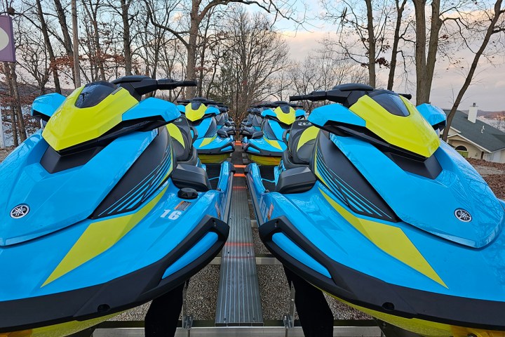 a blue motorcycle parked in a parking lot