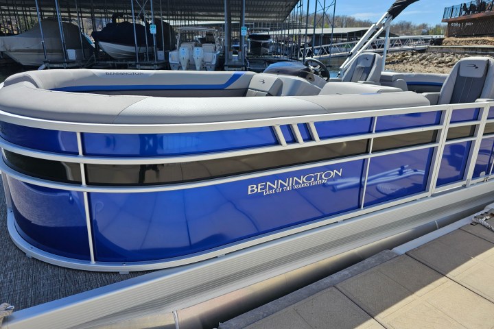 a boat parked on the side of a fence