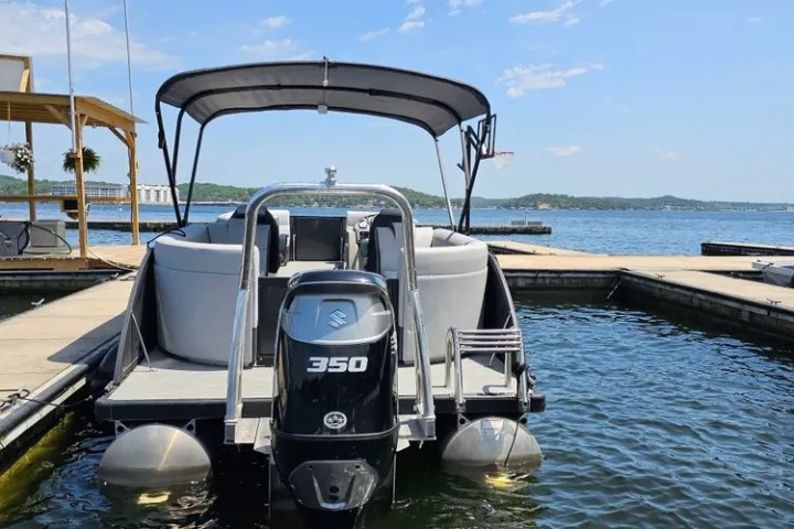 a boat is docked next to a body of water